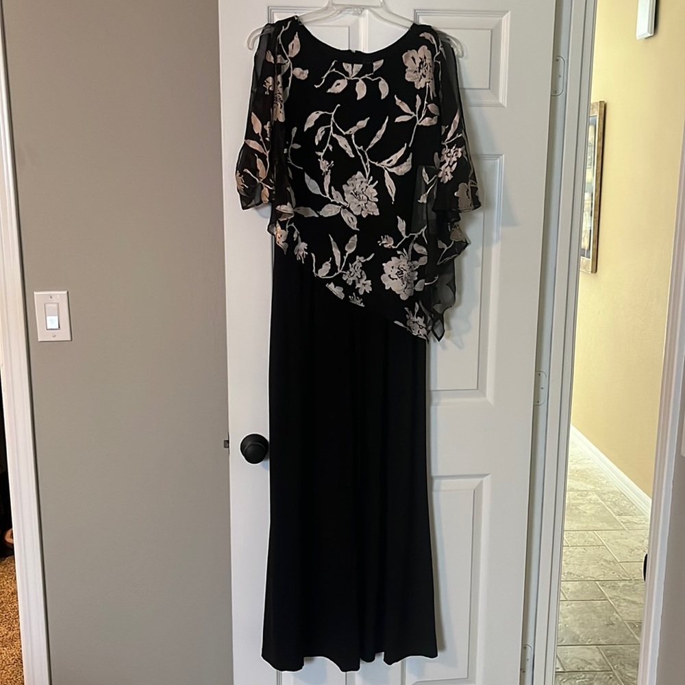 Black jumpsuit with asymmetrical sheer top